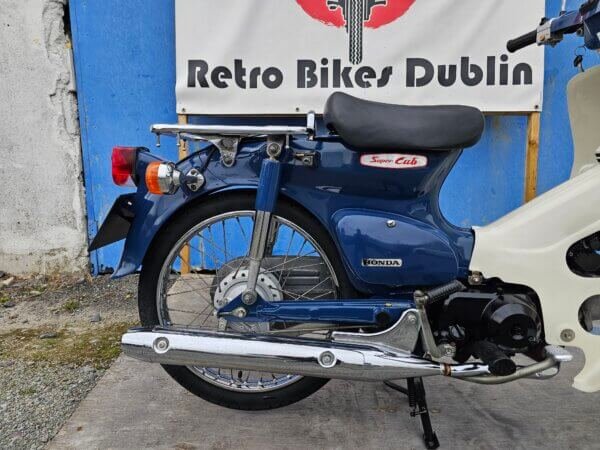 Rear view of 2007 Honda Super Cub C50 Fuel Injected at Retro Bikes Dublin