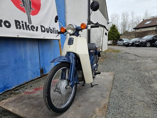 Front left view of 2007 Honda Super Cub C50 Fuel Injected